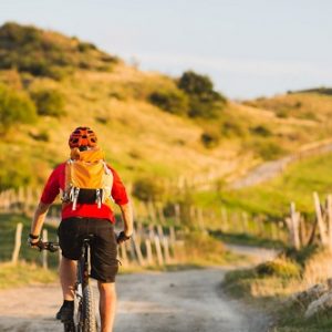 Bicycle riding enduro adventure in sunset mountains